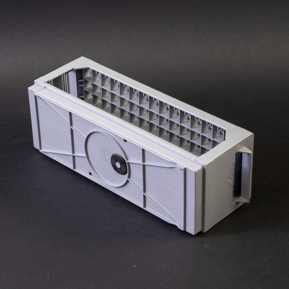 A gray plastic shelf with perforated design, allowing for location and storage of vials.
