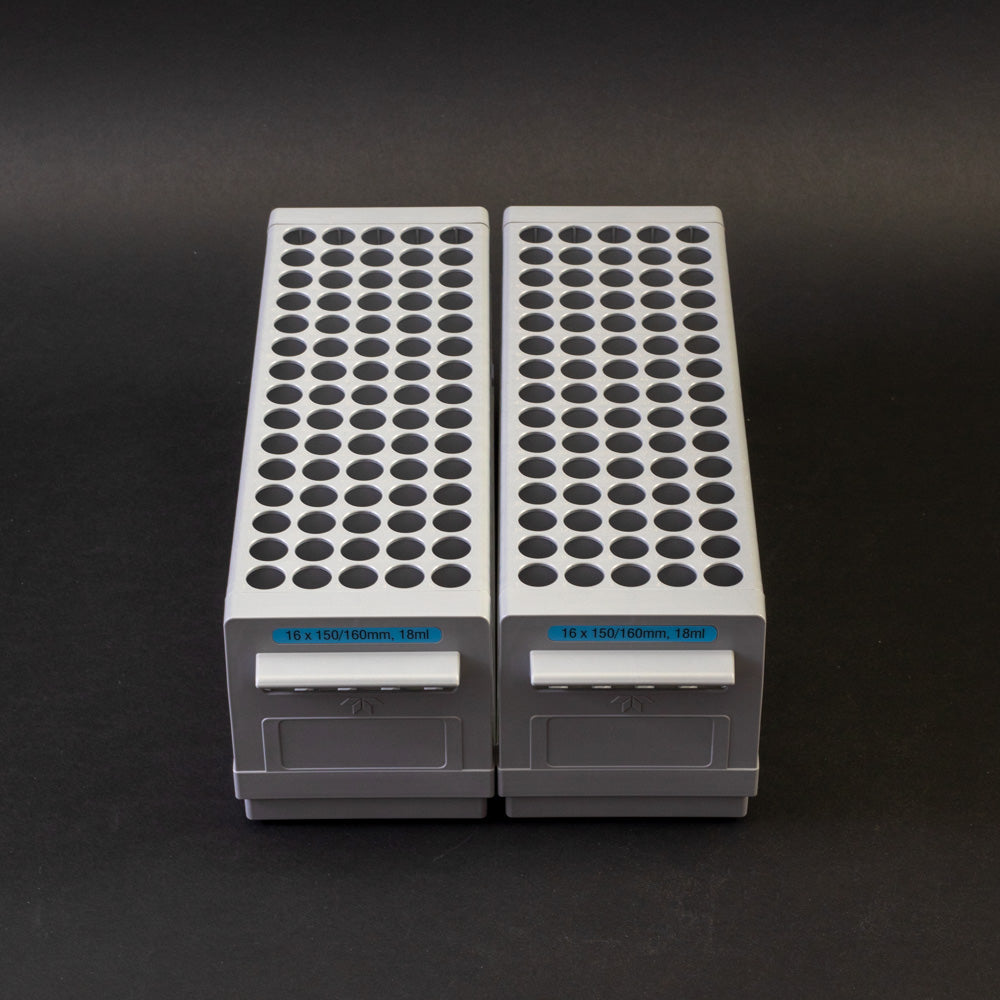 A pair of gray plastic shelves with perforated design, allowing for location and storage of vials.