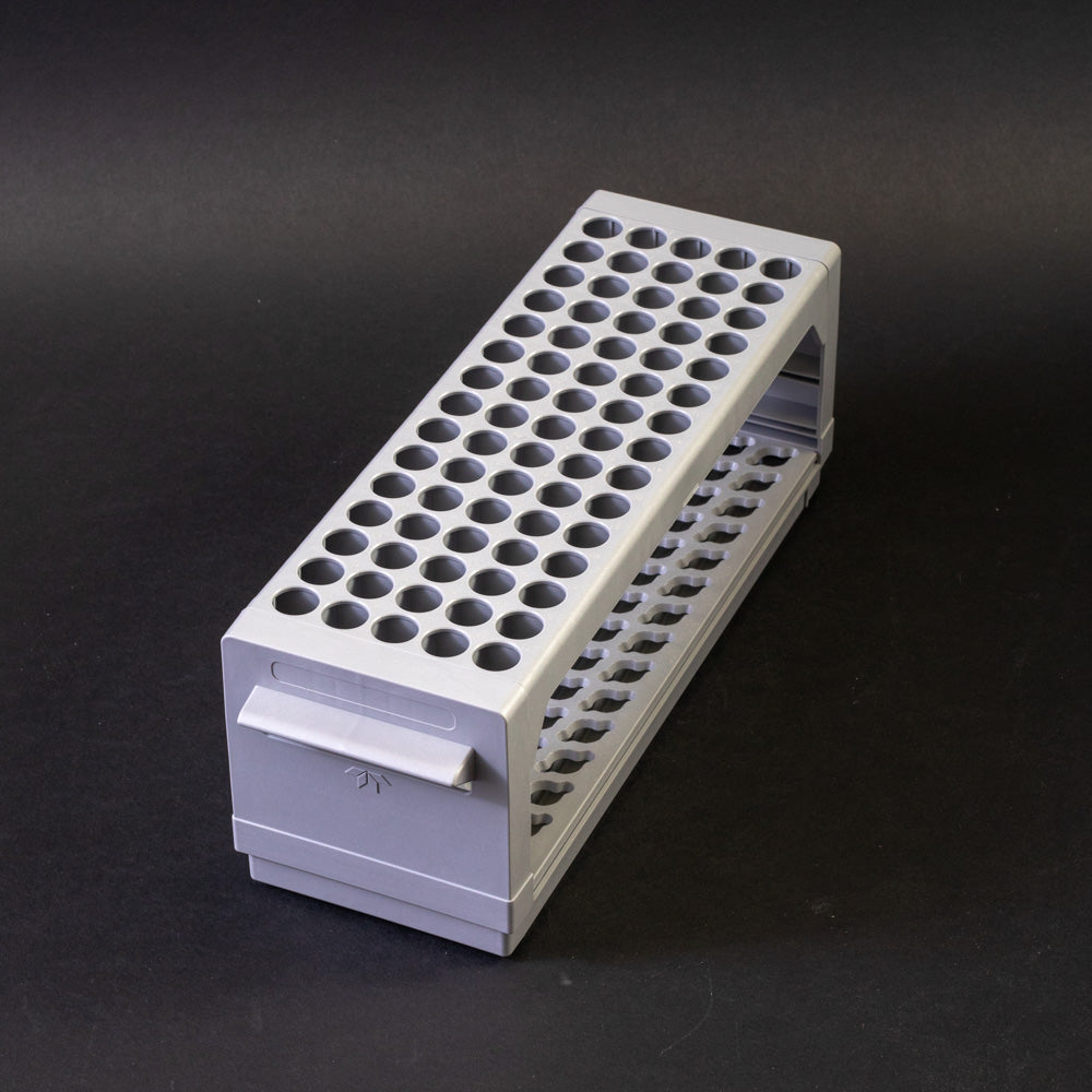 A gray plastic shelf with perforated design, allowing for location and storage of vials.