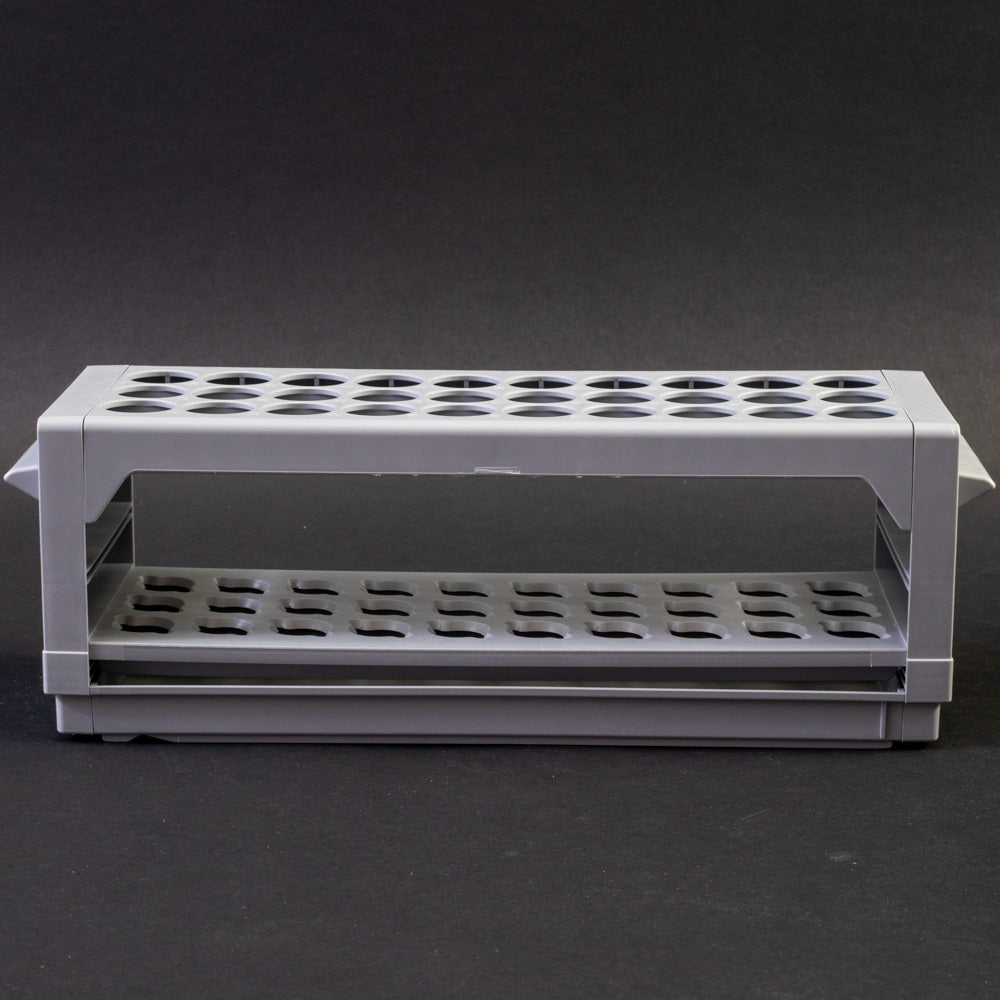 A gray plastic shelf with perforated design, allowing for location and storage of vials.