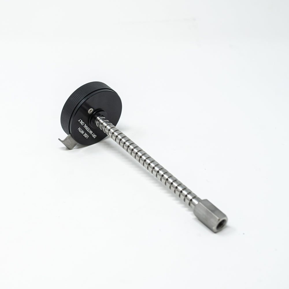 A stainless steel object featuring a sleek rod, showcasing a minimalist design and modern aesthetic.