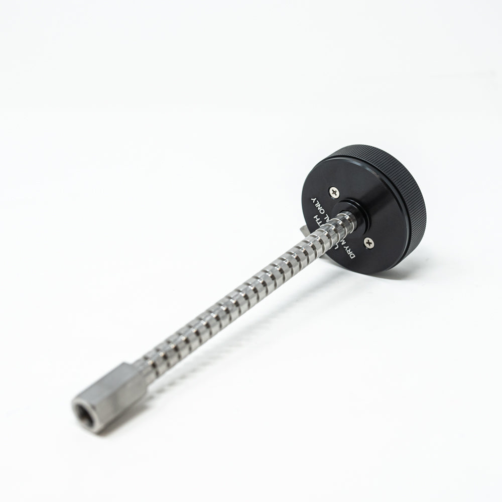 A stainless steel object featuring a sleek rod, showcasing a minimalist design and modern aesthetic.