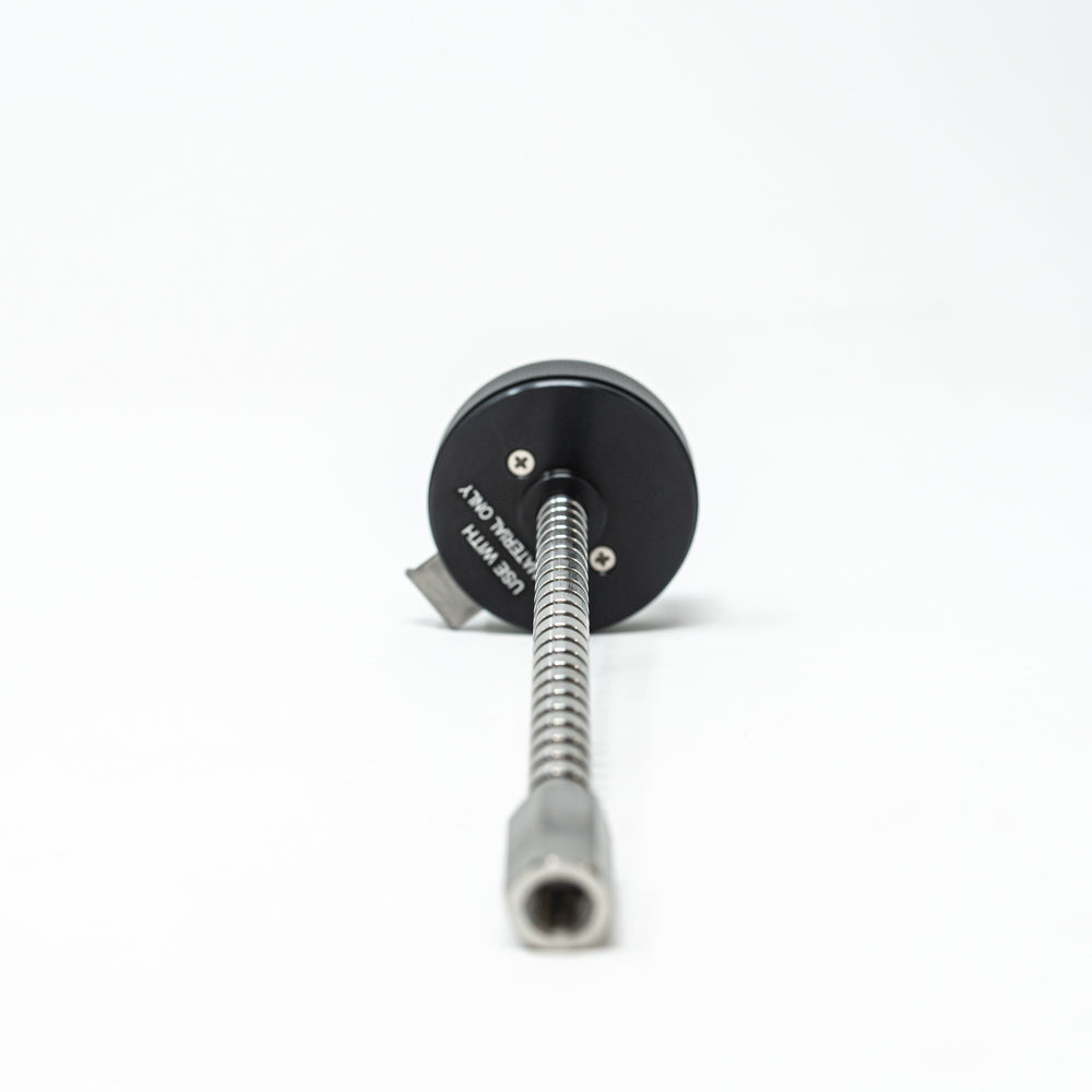 A stainless steel object featuring a sleek rod, showcasing a minimalist design and modern aesthetic.