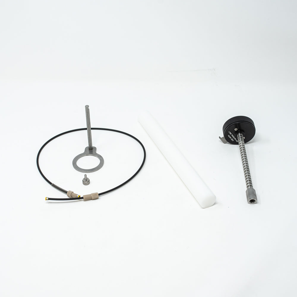 A stainless steel object featuring a sleek rod, showcasing a minimalist design and modern aesthetic.
