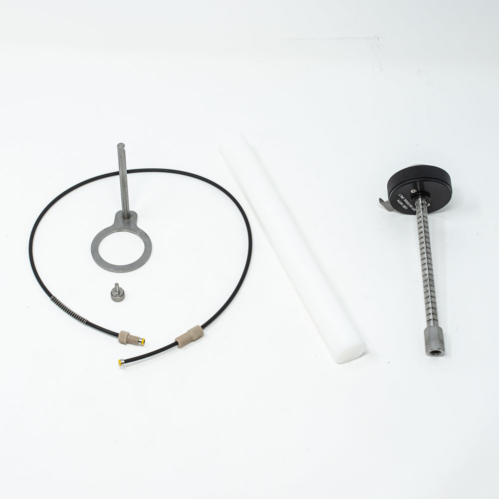 A stainless steel object featuring a sleek rod, showcasing a minimalist design and modern aesthetic.