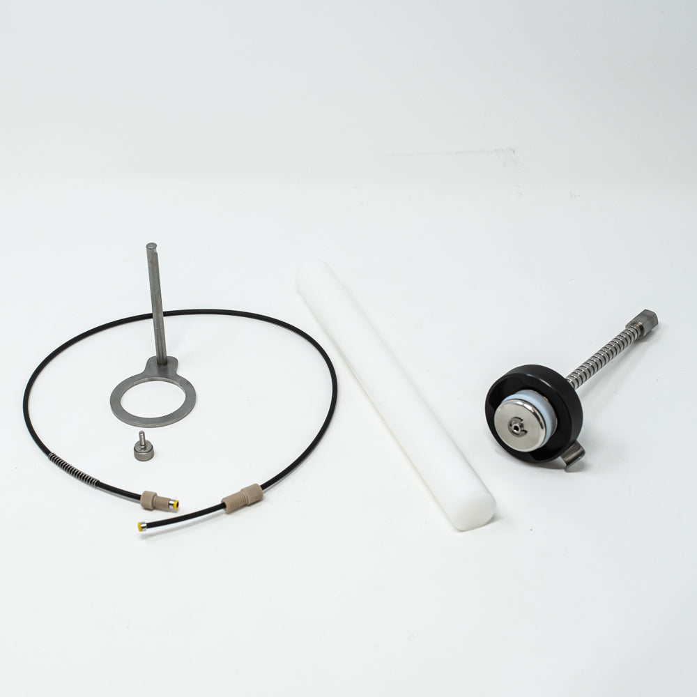 A stainless steel object featuring a sleek rod, showcasing a minimalist design and modern aesthetic.