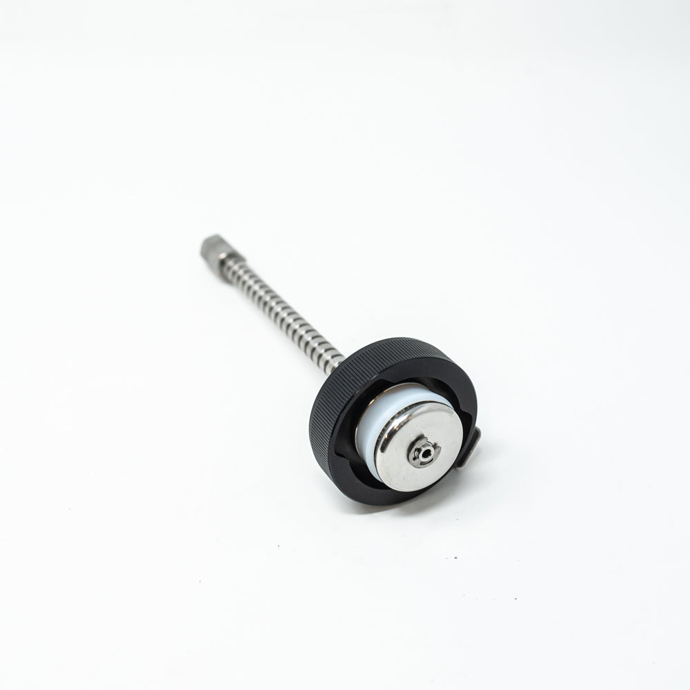 A stainless steel object featuring a sleek rod, showcasing a minimalist design and modern aesthetic.