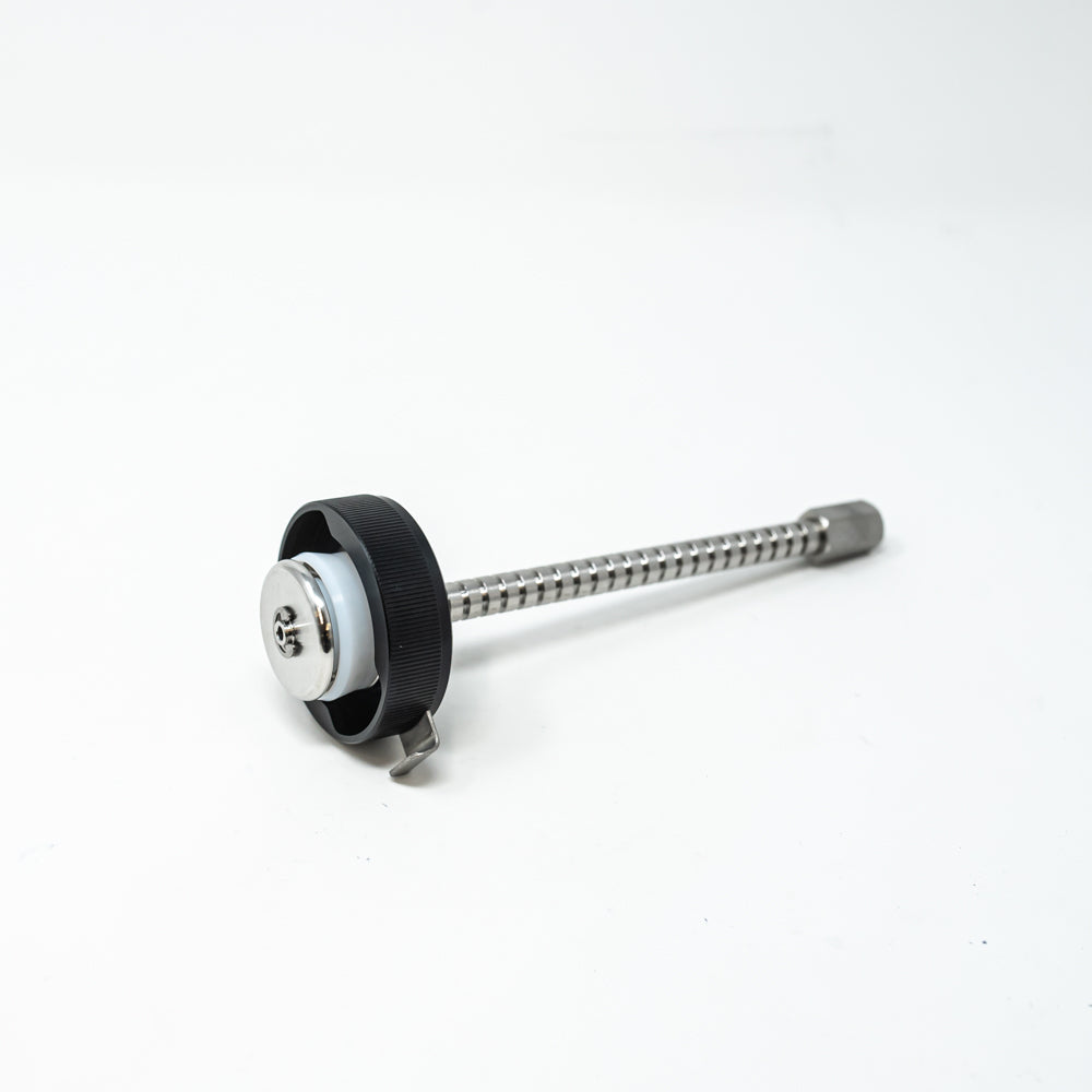 A stainless steel object featuring a sleek rod, showcasing a minimalist design and modern aesthetic.