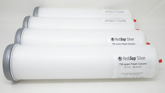 A group of plastic tubes with red and silver caps, positioned side by side, emphasizing their contrasting colors and forms.