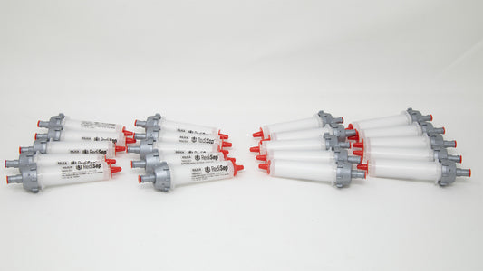 A group of plastic tubes with red and silver caps, positioned side by side, emphasizing their contrasting colors and forms.
