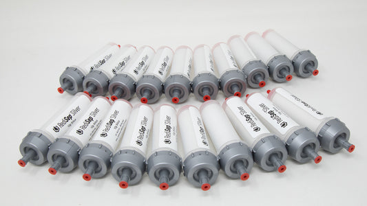 A group of plastic tubes with red and silver caps, positioned side by side, emphasizing their contrasting colors and forms.