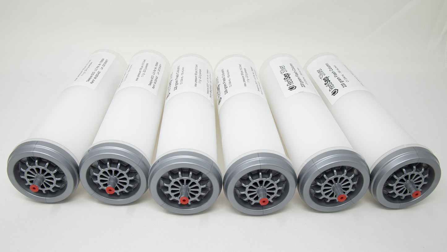 A group of plastic tubes with red and silver caps, positioned side by side, emphasizing their contrasting colors and forms.
