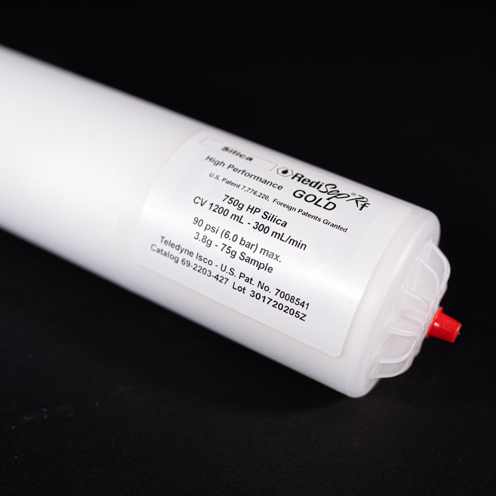 A small white tube with red cap displayed on a black background, creating a striking visual contrast between the two elements.