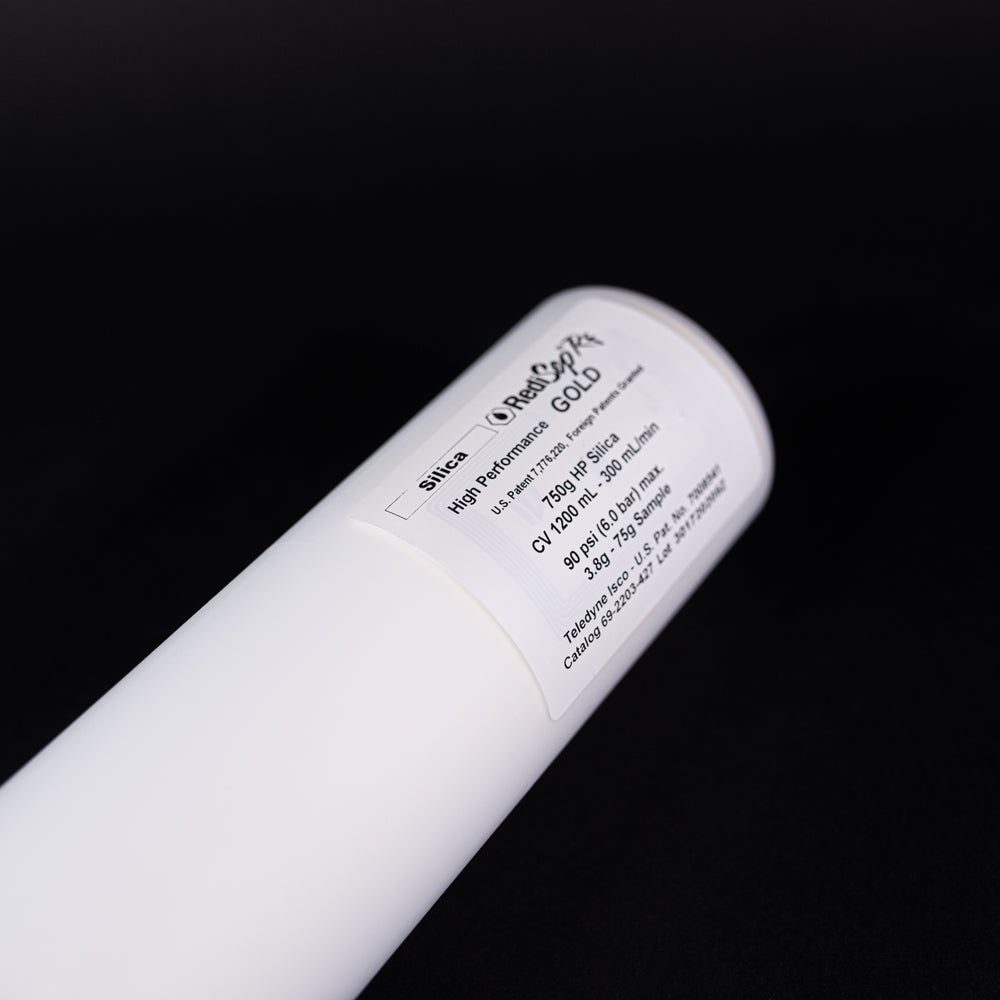 A small white tube displayed on a black background, creating a striking visual contrast between the two elements.