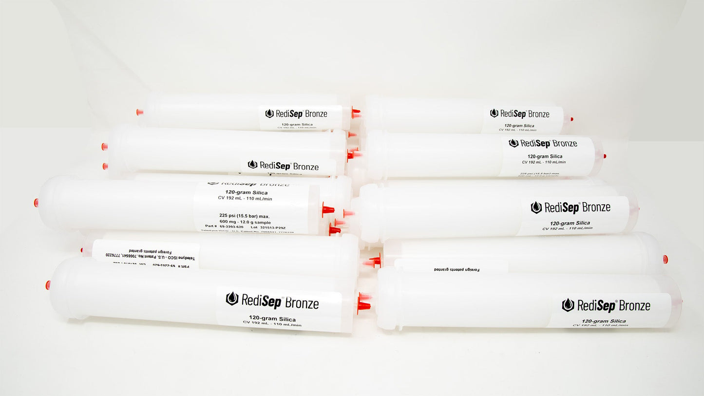 A group of plastic tubes with red caps, positioned side by side, emphasizing their contrasting colors and forms.