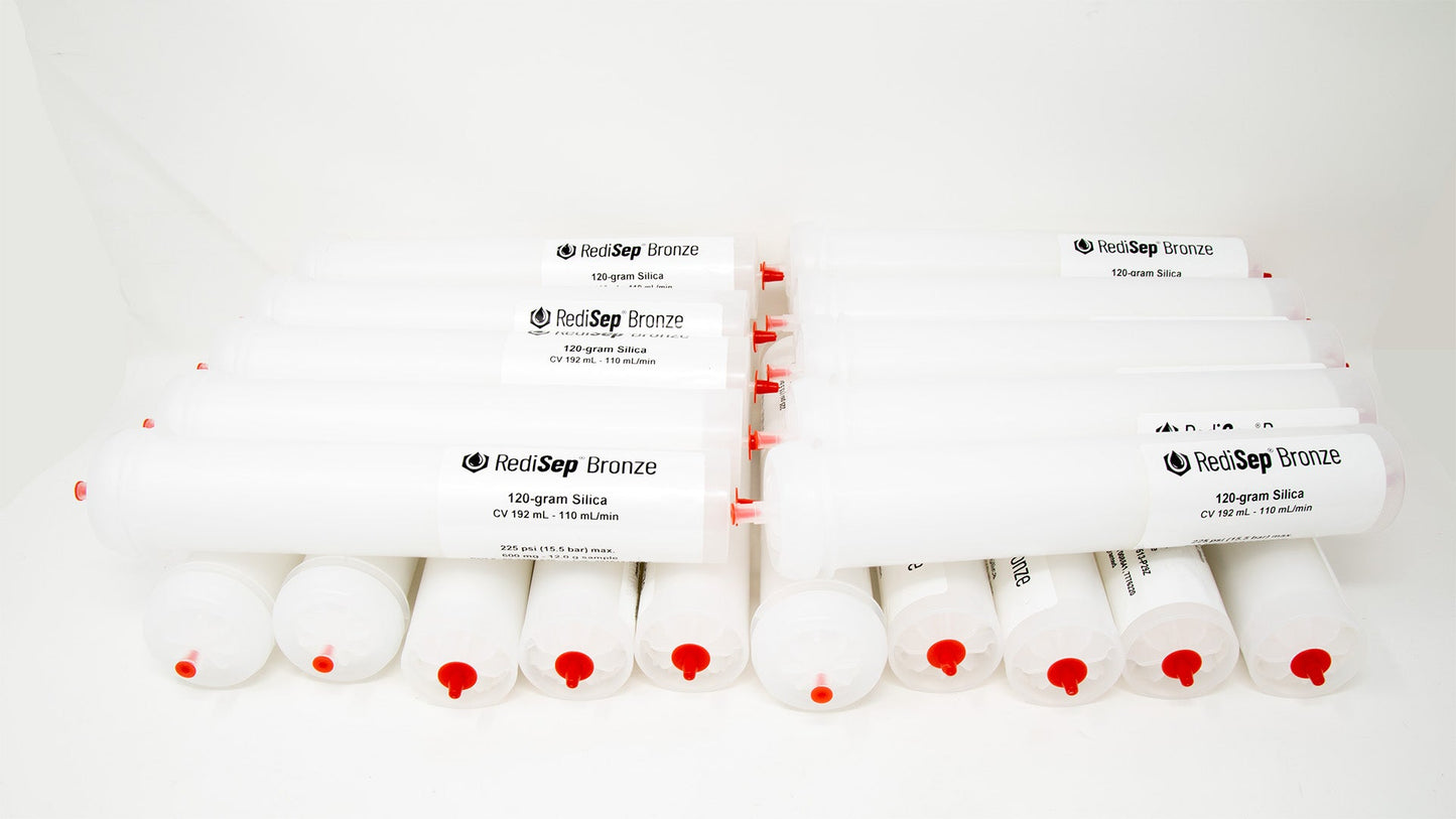 A group of plastic tubes with red caps, positioned side by side, emphasizing their contrasting colors and forms.