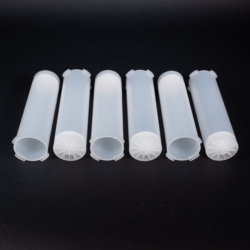 A set of small clear plastic cartridges displayed on a black background, creating a striking visual contrast between the two elements.