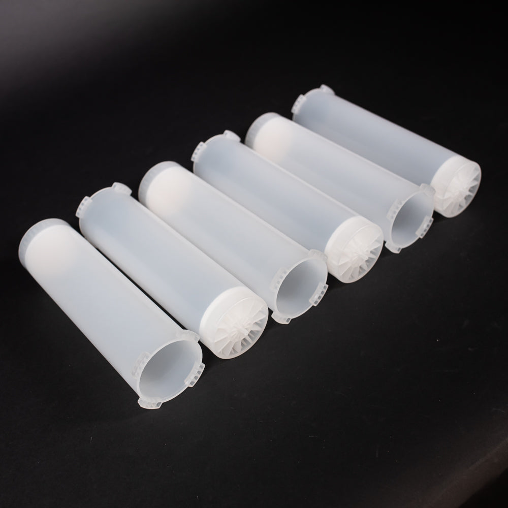 A set of small clear plastic cartridges displayed on a black background, creating a striking visual contrast between the two elements.