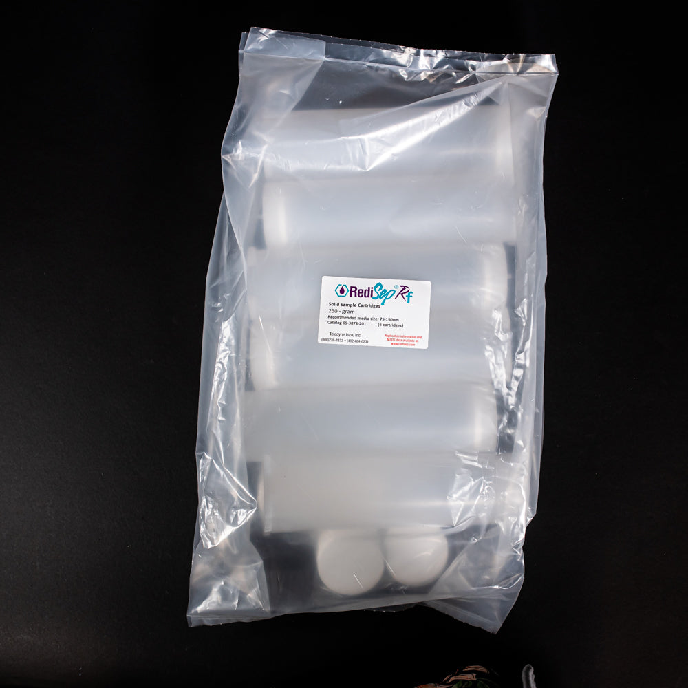 A set of small clear plastic cartridges displayed in a bag on a black background, creating a striking visual contrast between the two elements.