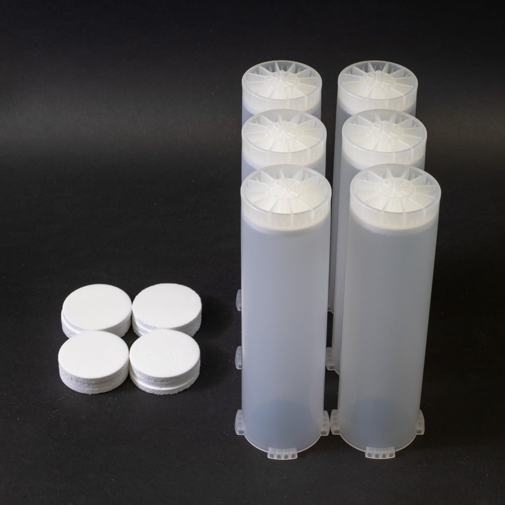 A set of small clear plastic cartridges displayed on a black background, creating a striking visual contrast between the two elements.