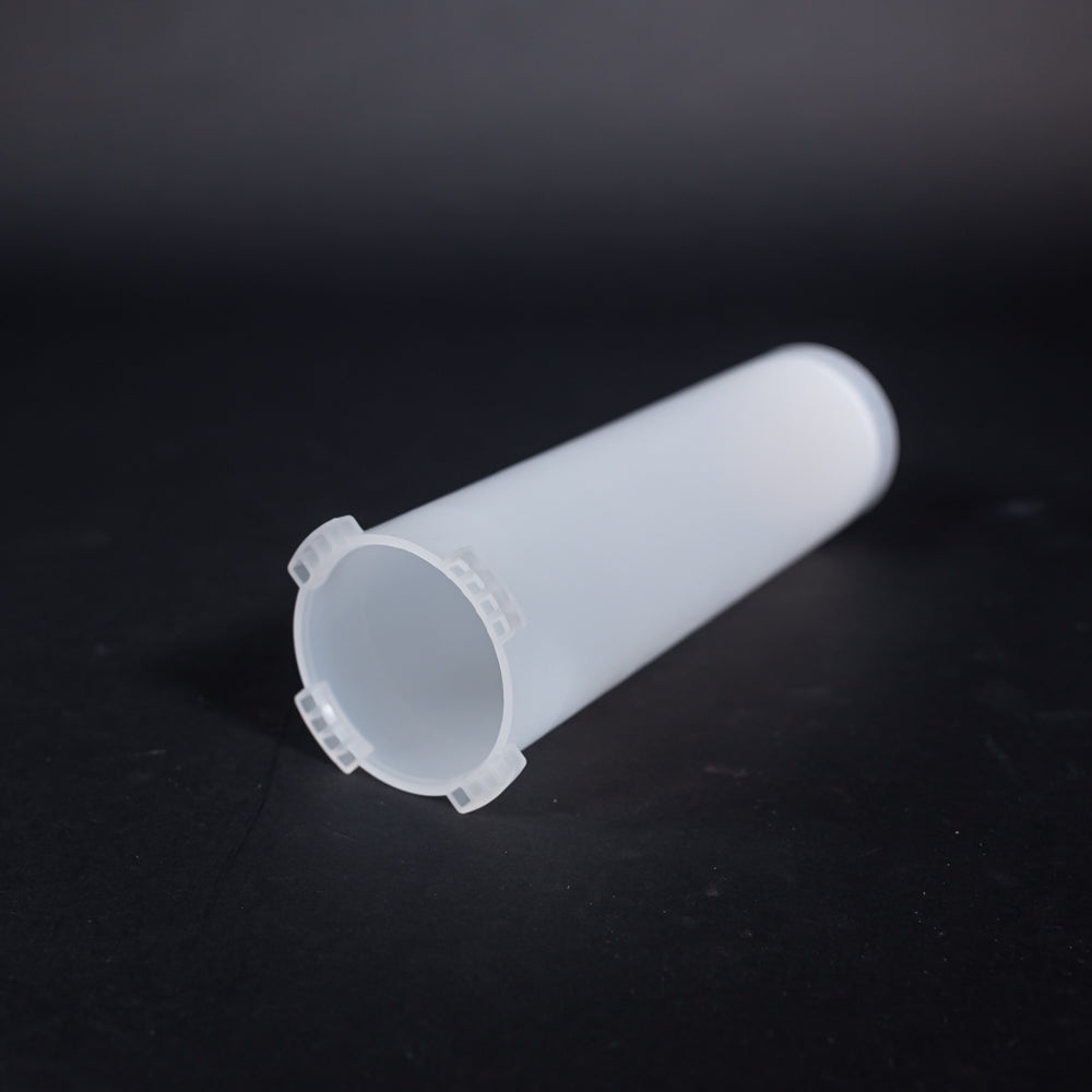 A small clear plastic cartridge displayed on a black background, creating a striking visual contrast between the two elements.