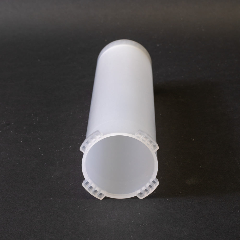 A small clear plastic cartridge displayed on a black background, creating a striking visual contrast between the two elements.