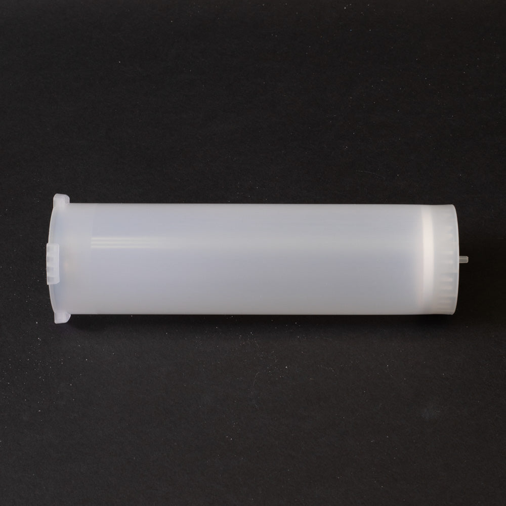 A small clear plastic cartridge displayed on a black background, creating a striking visual contrast between the two elements.