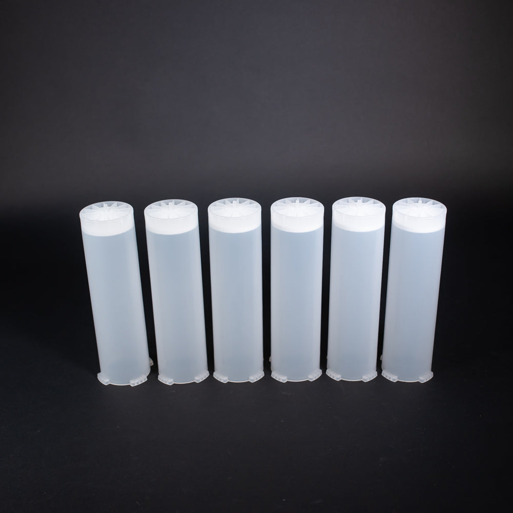 A set of small clear plastic cartridges displayed on a black background, creating a striking visual contrast between the two elements.