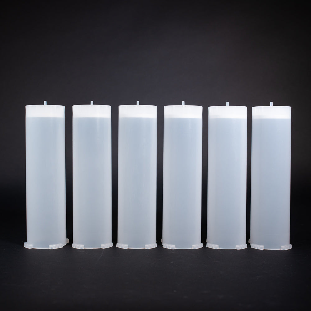 A set of small clear plastic cartridges displayed on a black background, creating a striking visual contrast between the two elements.