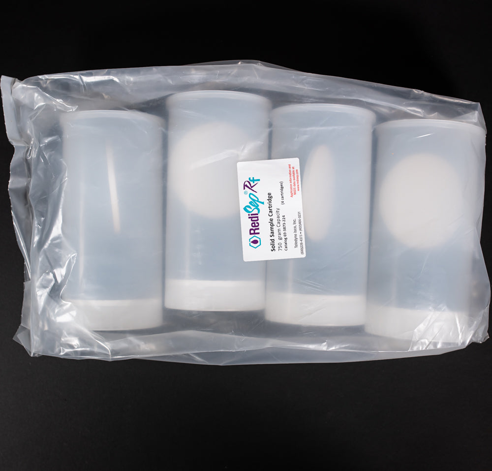 A set of plastic cartridges positioned against a solid black background, creating a striking contrast in colors.