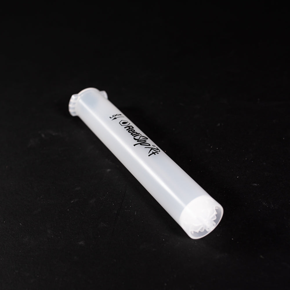 A small clear plastic cartridge displayed on a black background, creating a striking visual contrast between the two elements.