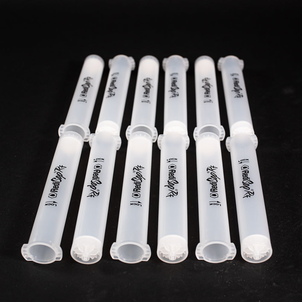 A set of small clear plastic cartridges displayed on a black background, creating a striking visual contrast between the two elements.