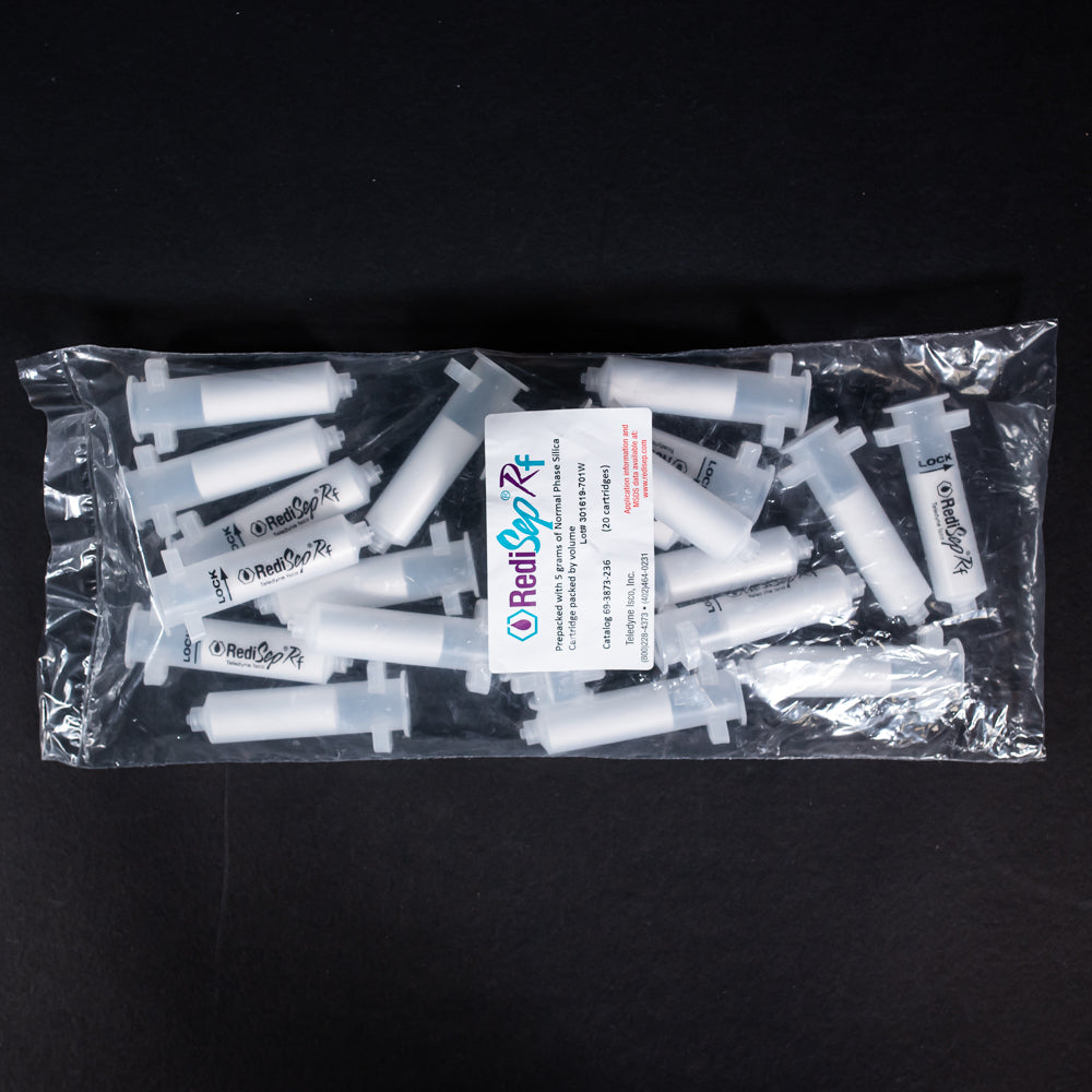 A set of small clear plastic cartridges displayed in a bag on a black background, creating a striking visual contrast between the two elements.
