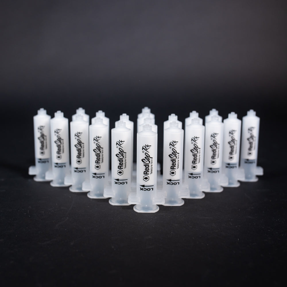 A set of small clear plastic cartridges displayed on a black background, creating a striking visual contrast between the two elements.