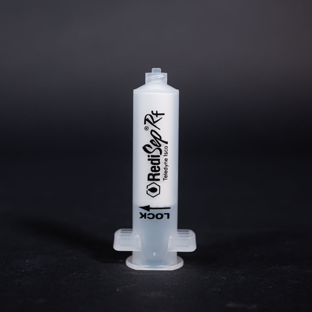 A small clear plastic cartridge displayed on a black background, creating a striking visual contrast between the two elements.