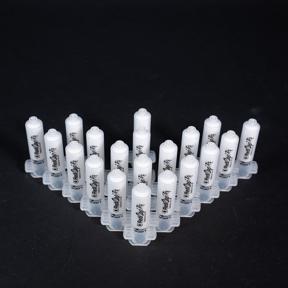 A set of small clear plastic cartridges displayed on a black background, creating a striking visual contrast between the two elements.