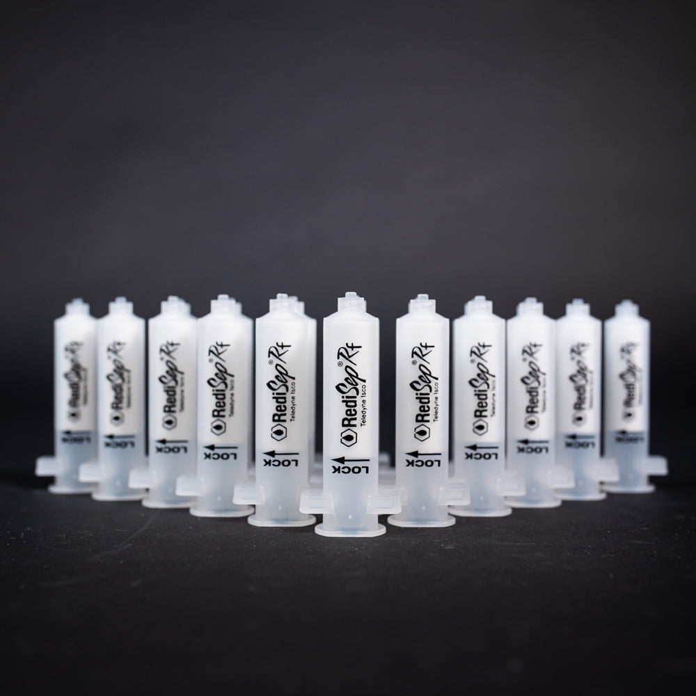 A set of small clear plastic cartridges displayed on a black background, creating a striking visual contrast between the two elements.