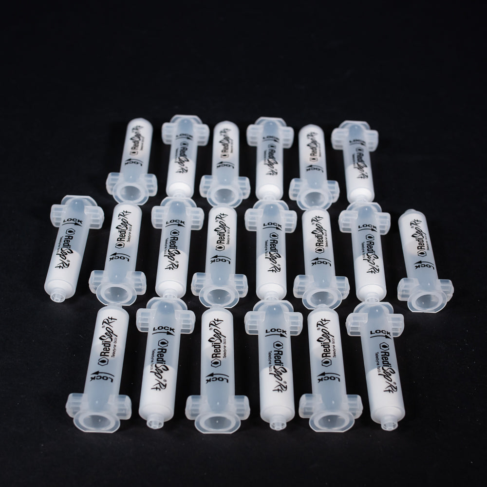 A set of small clear plastic cartridges displayed on a black background, creating a striking visual contrast between the two elements.