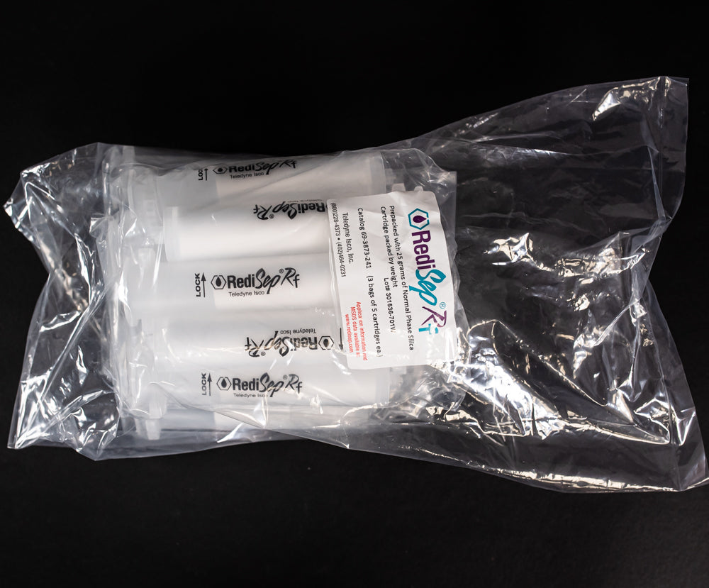 A set of small clear plastic cartridges displayed in a bag on a black background, creating a striking visual contrast between the two elements.