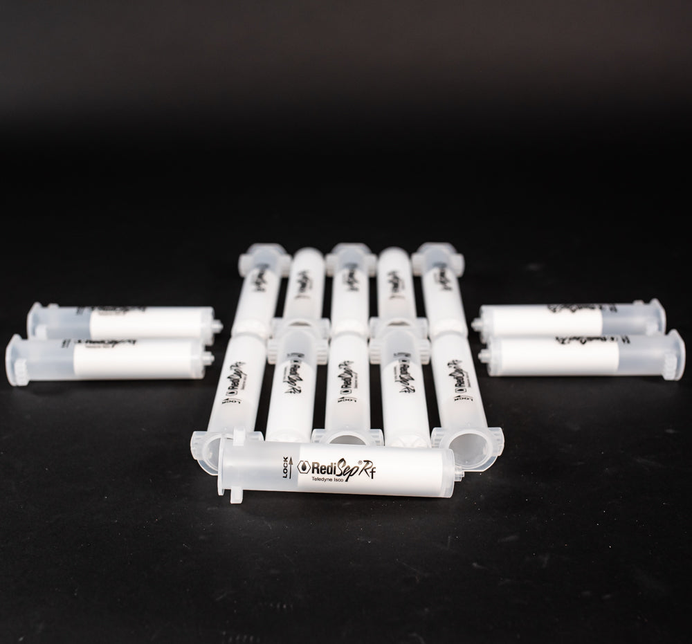 A set of small clear plastic cartridges displayed on a black background, creating a striking visual contrast between the two elements.