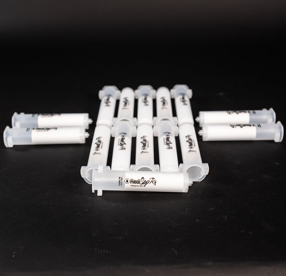 A set of small clear plastic cartridges displayed on a black background, creating a striking visual contrast between the two elements.