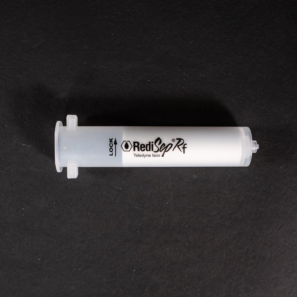 A small clear plastic cartridge displayed on a black background, creating a striking visual contrast between the two elements.