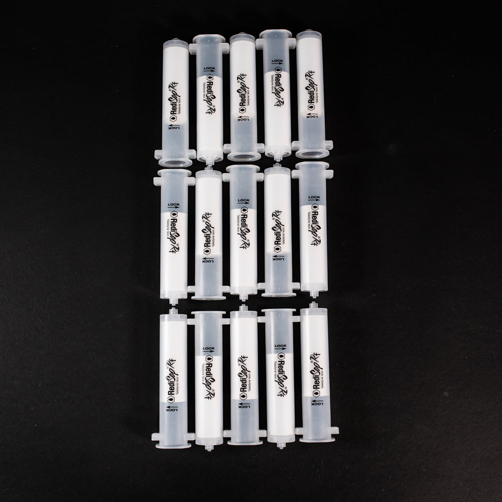 A set of small clear plastic cartridges displayed on a black background, creating a striking visual contrast between the two elements.