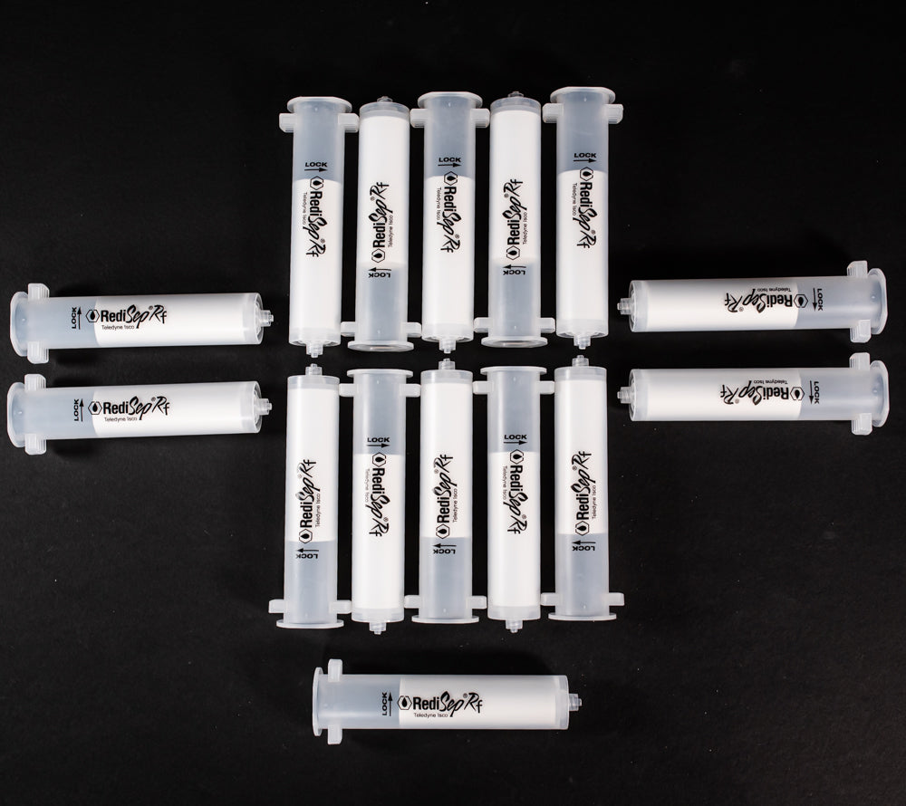 A set of small clear plastic cartridges displayed on a black background, creating a striking visual contrast between the two elements.