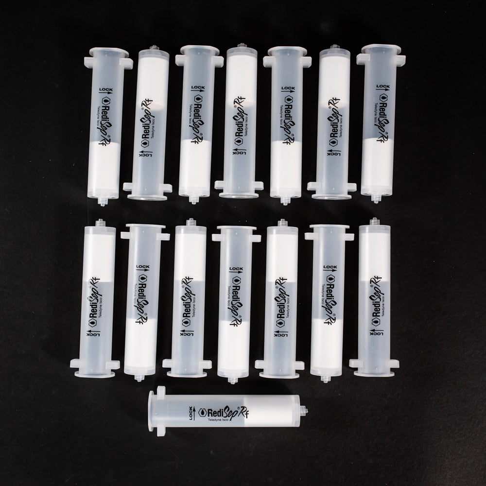 A set of small clear plastic cartridges displayed on a black background, creating a striking visual contrast between the two elements.