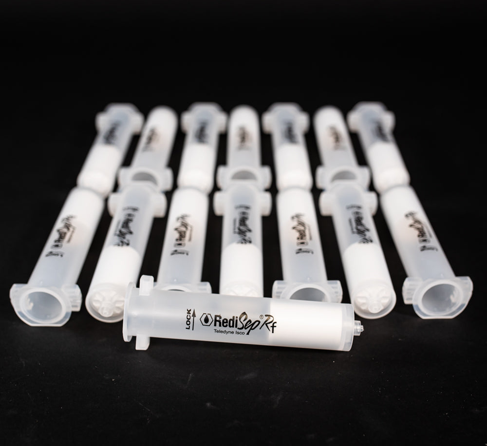A set of small clear plastic cartridges displayed on a black background, creating a striking visual contrast between the two elements.