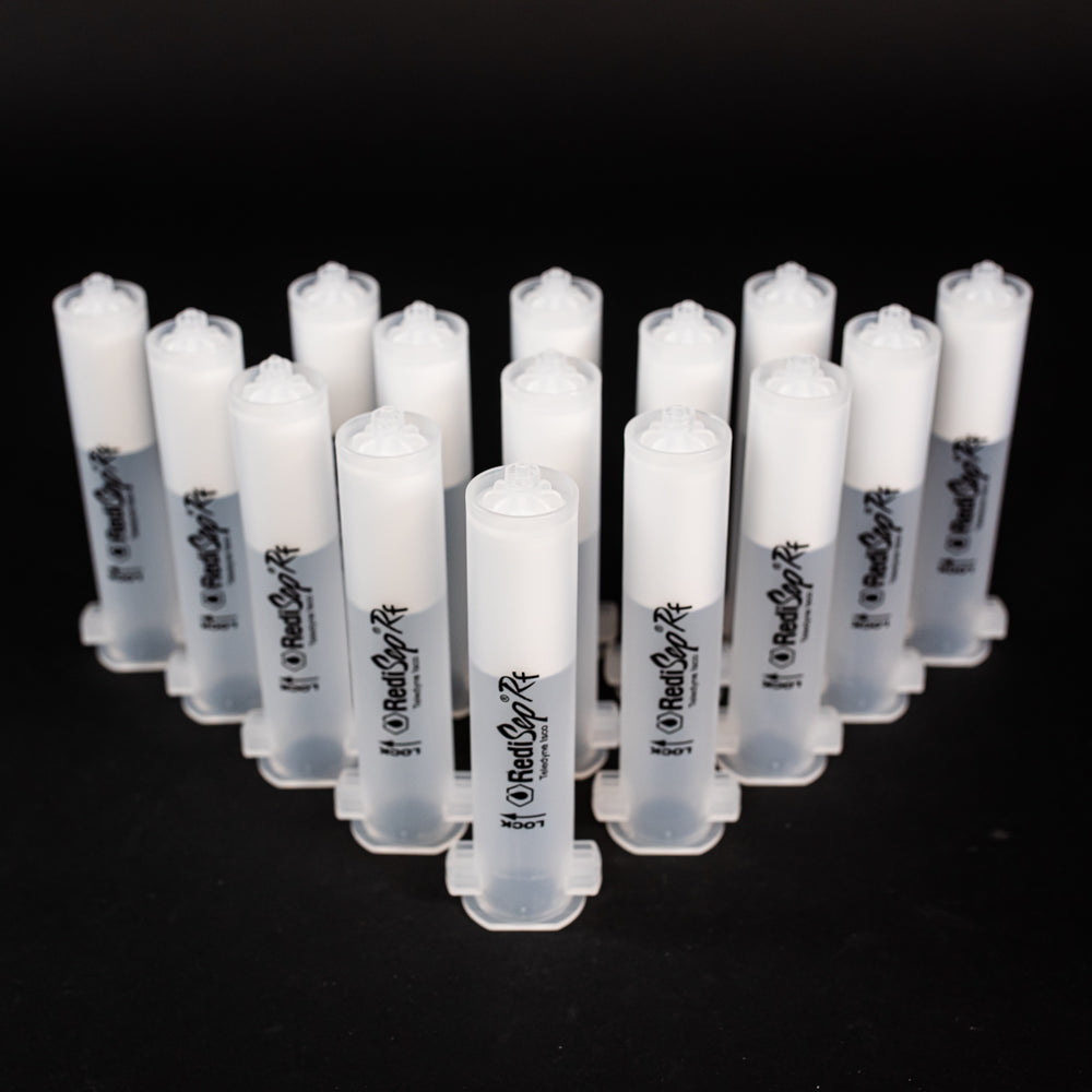 A set of small clear plastic cartridges displayed on a black background, creating a striking visual contrast between the two elements.