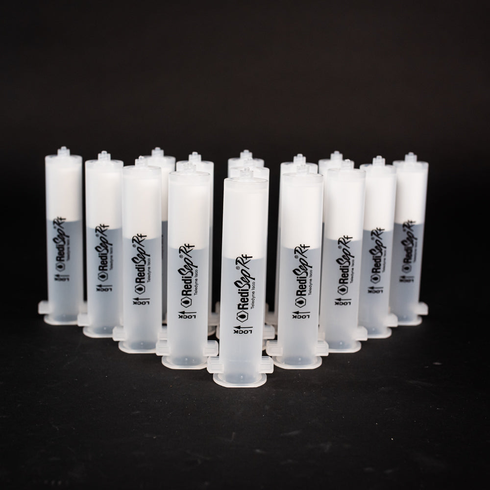 A set of small clear plastic cartridges displayed on a black background, creating a striking visual contrast between the two elements.