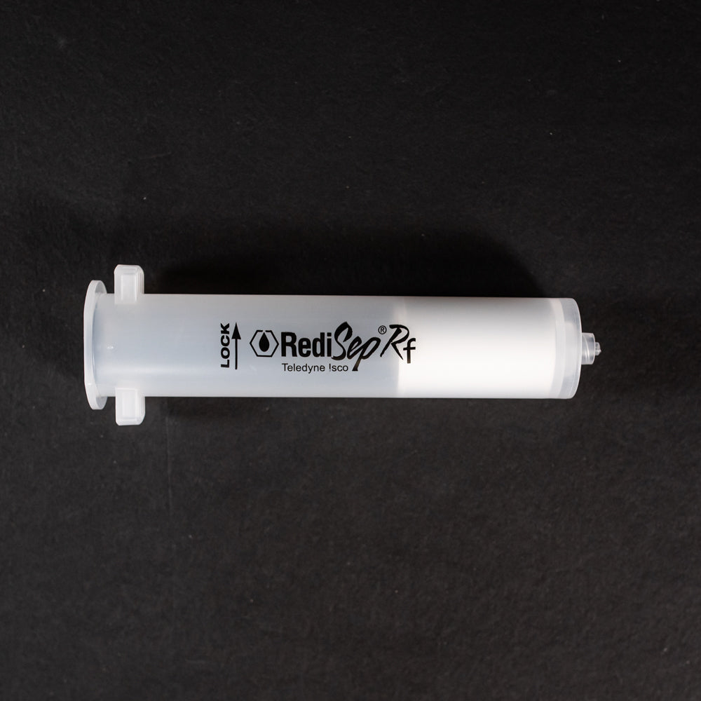 A small clear plastic cartridge displayed on a black background, creating a striking visual contrast between the two elements.