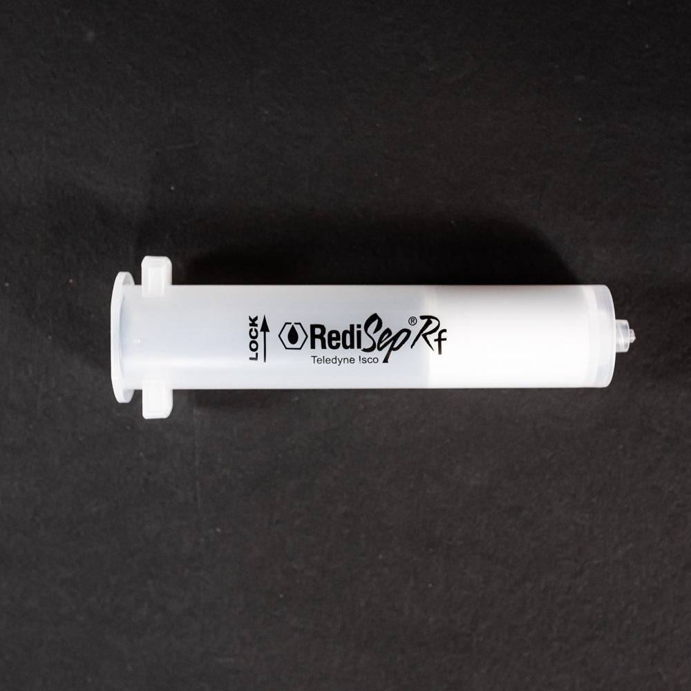 A small clear plastic cartridge displayed on a black background, creating a striking visual contrast between the two elements.